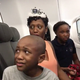 Minta Burke and her two children (YouTube screenshot)